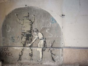 stefano majno israel west bank wall banksy graffiti street art baby child soldier perquisition.jpg.jpg